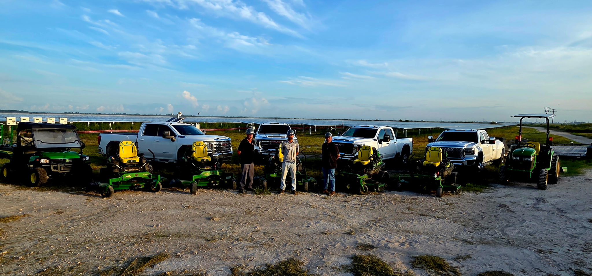The 3 Landscape LLC crew and equipment lined up in the field