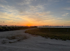 Dirt access road at sunset